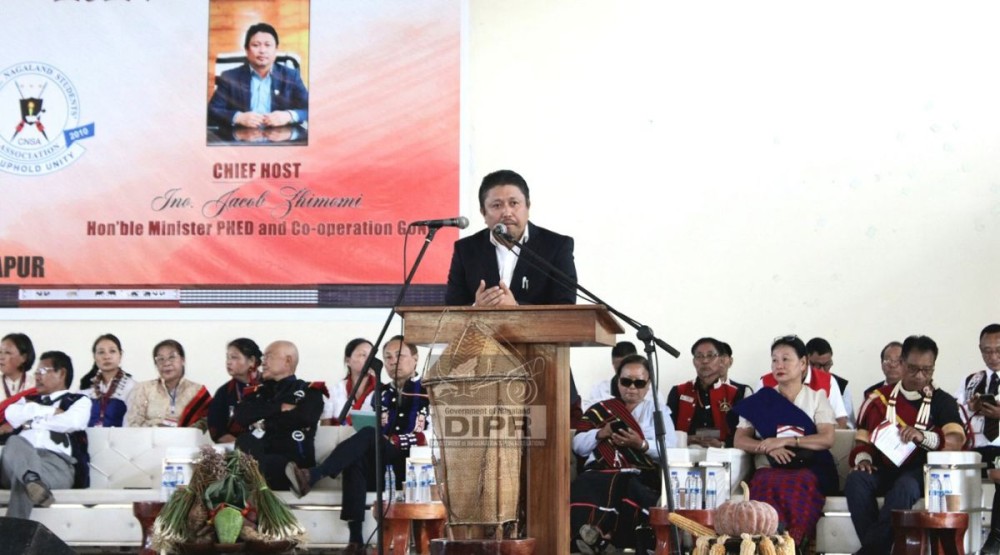 Minister for PHED, Jacob Zhimomi addressing the CNTC cultural exchange program at the Senden Riju, Purana Bazaar, Dimapur on November 20. (DIPR Photo)